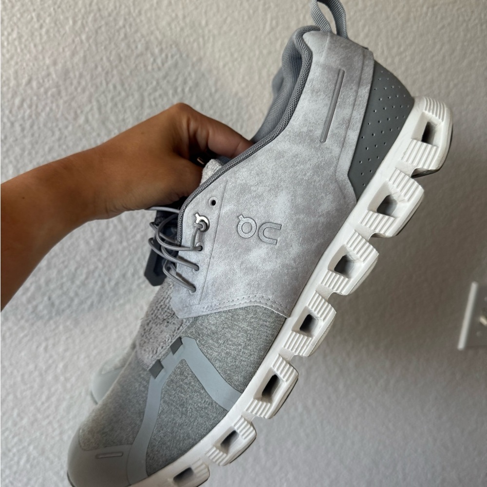 On Running Gray and White Sneakers with Cloud Cushioning